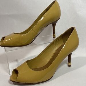 Tory Burch patent leather peep-toe pumps in mustard